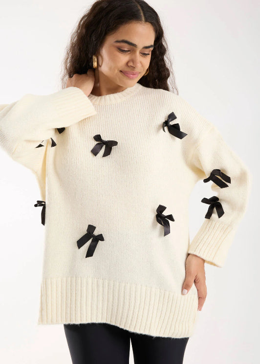 Pull blanc cassé avec Nœuds Satinés Noirs