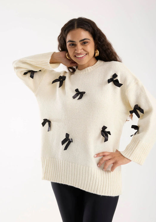 Pull blanc cassé avec Nœuds Satinés Noirs